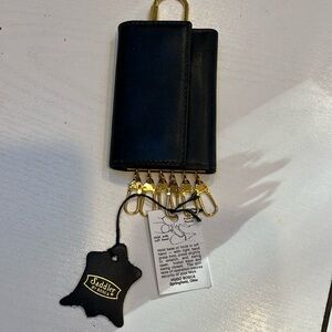 PRICE DROP !! Vintage Saddler by Bosca leather key Caddy trifold snap.Brand new.